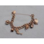 A 9CT GOLD CHARM BRACELET AND CHARMS