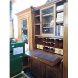 A LATE VICTORIAN WALNUT SECRETAIRE BOOKCASE