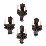 FOUR CARVED AND STAINED OAK TWIN LIGHT WALL APPLIQUES