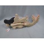 AN ASIAN CARVED AND PAINTED WOOD MERMAID