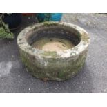 A CIRCULAR STONE TROUGH, WITH TOOLED SURFACE