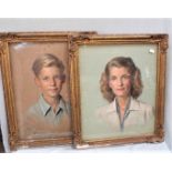 A PAIR OF PASTEL PORTRAITS, SIGNED 'VOYSEY'