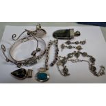 A COLLECTION OF SILVER AND UNMARKED WHITE METAL JEWELLERY