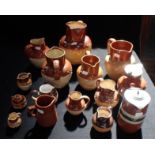 A COLLECTION OF STONEWARE MOULDED JUGS
