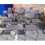 A SET OF EIGHT WROUGHT AND PIERCED METAL GARDEN CHAIRS