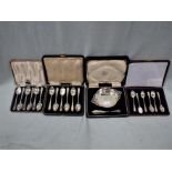 THREE CASED SETS OF SILVER TEASPOONS, AND A SILVER BUTTER DISH