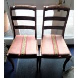 A PAIR OF REGENCY ROSEWOOD CHAIRS WITH CARVED SABRE LEGS