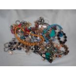 A COLLECTION OF BEADS AND COSTUME JEWELLERY