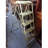 A VINTAGE PAINTED STEEL STEPLADDER