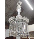 A MOULDED AND CUT GLASS FOUR LIGHT ELOCTROLIER