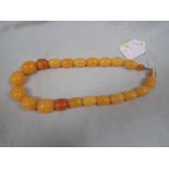 A YELLOW 'AMBER' BEAD NECKLACE