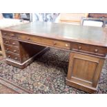 A 19TH CENTURY MAHOGANY PARTNER'S DESK