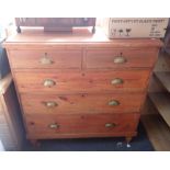 A LATE 19TH CENTURY STAINED PINE CHEST OF DRAWERS