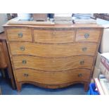 A LATE GEORGE III MAHOGANY SERPENTINE CHEST OF DRAWERS