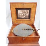 A LATE 19TH CENTURY WALNUT-CASED TABLE POLYPHON