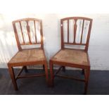 A PAIR OF EARLY 19TH CENTURY ELM COUNTRY CHAIRS