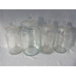 FOUR VINTAGE GLASS STORAGE JARS, WITH GLASS LIDS