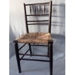 A 'SUSSEX' TYPE EBONISED ASH SINGLE CHAIR