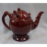 A BROWN GLAZED CADOGAN TEAPOT