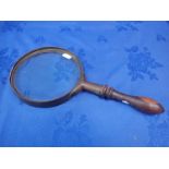 A LARGE MAGNIFYING GLASS