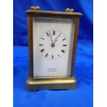A BRASS-CASED CARRIAGE CLOCK BY HENNESSY OF SWANSEA