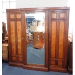 A LARGE WALNUT AND SATINWOOD BREAKFRONT WARDROBE