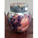 A MOORCROFT POMEGRANATE JAR AND COVER