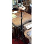 A VICTORIAN WROUGHT IRON AND COPPER STANDARD LAMP