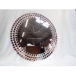 A CONTEMPORARY CIRCULAR MIRROR