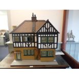 A 1930S TRI-ANG DOLL'S HOUSE