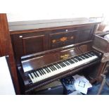 AN OVERSTRUNG UPRIGHT PIANO