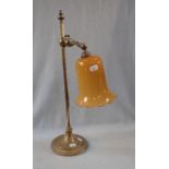 AN ADJUSTABLE EDWARDIAN BRASS DESK LAMP