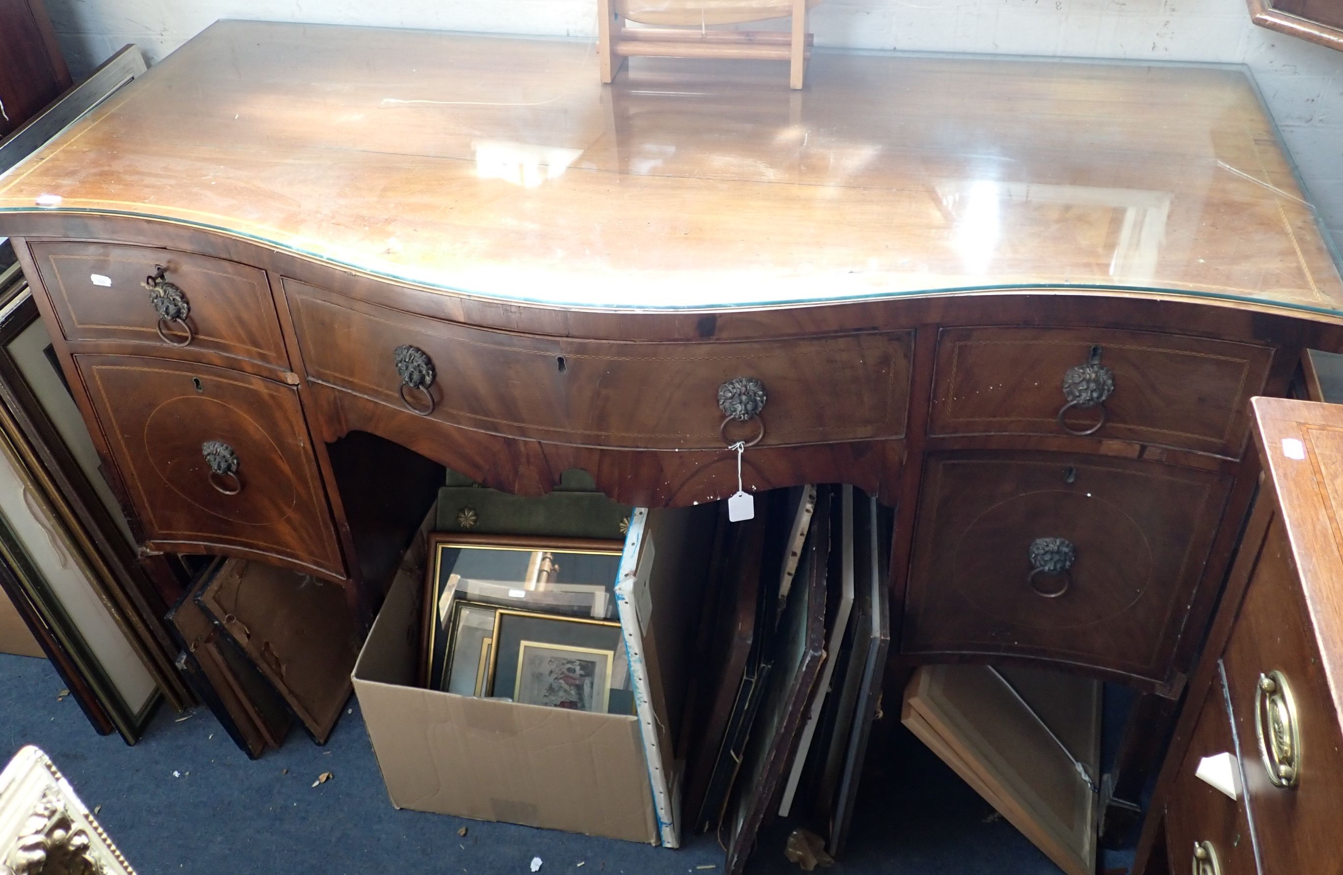 A GEORGE III MAHOGANY SERPENTINE FRONT SIDEBOARD