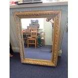 A GILTWOOD AND COMPOSITION MIRROR