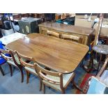 A RPRODUCTION REGENCY STYLE MAHOGANY DINING TABLE