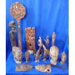 A COLLECTION OF AFRICAN AND OTHER CARVED WOODEN HEADS AND SCULPTURES