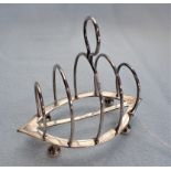 A CHINESE SILVER TOAST RACK