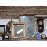 A REPRODUCTION GILT FRAMED MIRROR