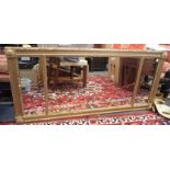 A GILTWOOD AND COMPOSITION OVERMANTLE MIRROR