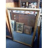 A GILTWOOD AND COMPOSITION MIRROR
