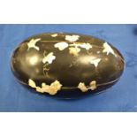 AN ASIAN BLACK LACQUER AND MOTHER OF PEARL CONTAINER