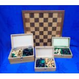 THREE BOXED CHESS SETS AND A BOARD