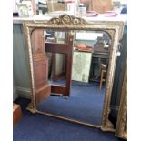 A GILTWOOD AND COMPOSITION OVERMANTEL MIRROR