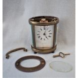 AN OVAL-CASED CARRIAGE CLOCK