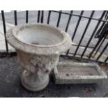 A RECONSTITUTED STONE GARDEN URN