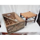 A VINTAGE SAN MIGUEL BOTTLE CRATE AND A WOODEN STOOL