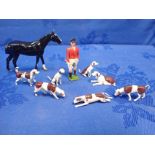 BRITAINS LTD: SEVEN HUNTING HOUNDS, A STANDING HUNTSMAN, AND HORSE