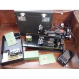 A SINGER 221K SERIES SEWING MACHINE, CASED WITH ACCESSIORIES