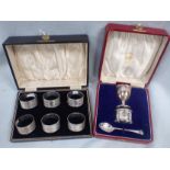 A CASED SET OF SIX ENGINE-TURNED SILVER NAPKIN RINGS