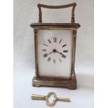 A BRASS-CASED CARRIAGE CLOCK